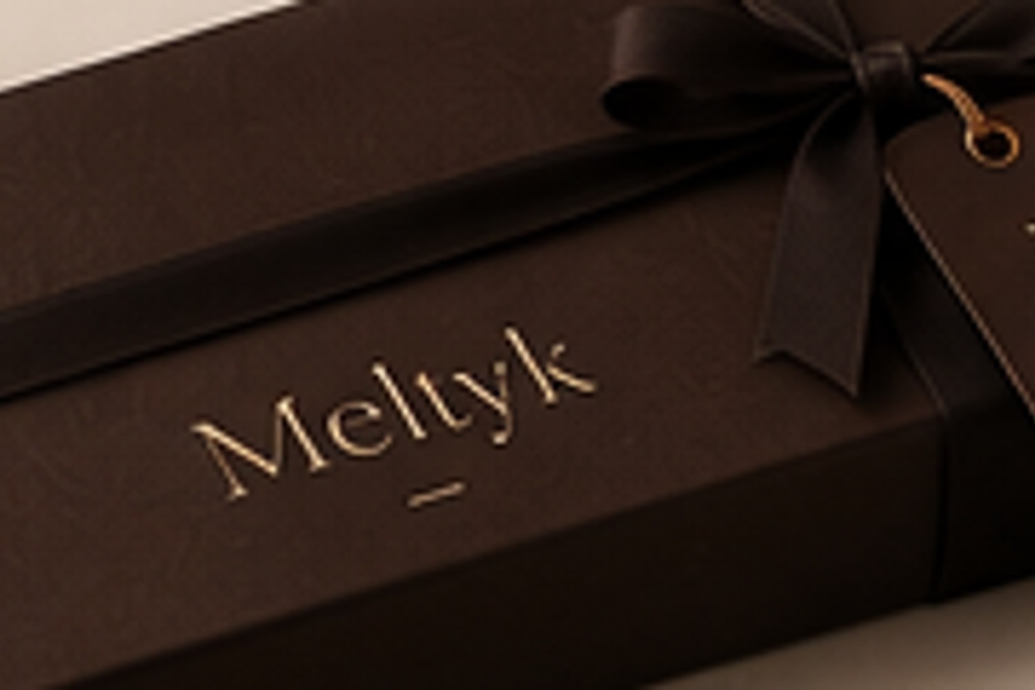 The Meltyk Gift Drawer open on hand-wrapped copper truffles